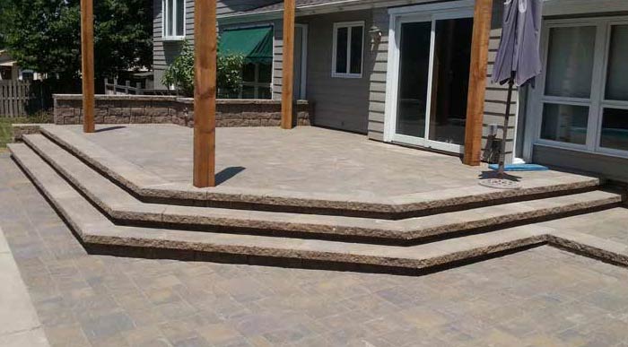 Custom Paved Patio | Stone Capped Wall with Stone Stairs