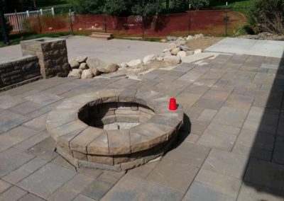 firepit-with-stone-paved-patio-and-capped-stone-wall-2