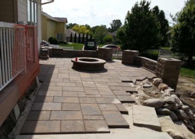 firepit-with-stone-paved-patio-and-capped-stone-wall-3