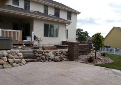 firepit-with-stone-paved-patio-and-capped-stone-wall-7