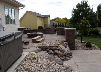 firepit-with-stone-paved-patio-and-capped-stone-wall-8