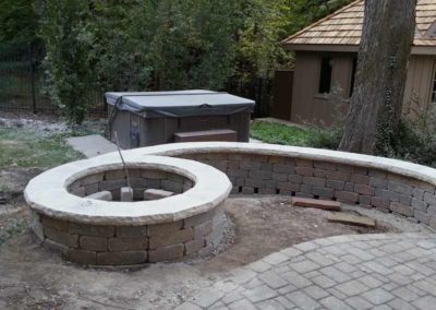 stone-capped-firepit-paved-backyard-patio-003