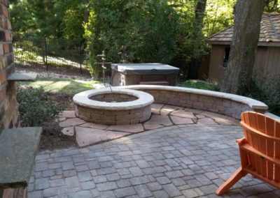 stone-capped-firepit-paved-backyard-patio-006