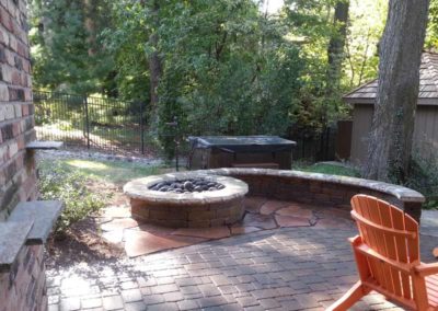 stone-capped-firepit-paved-backyard-patio-007