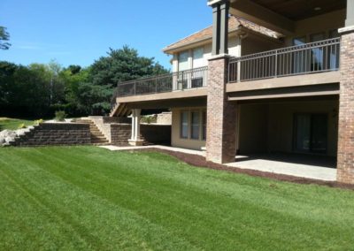 Retaining Wall with Stone Paved Patio & Custom Deck